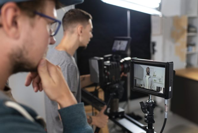 man-filming-with-professional-camera-new-movie